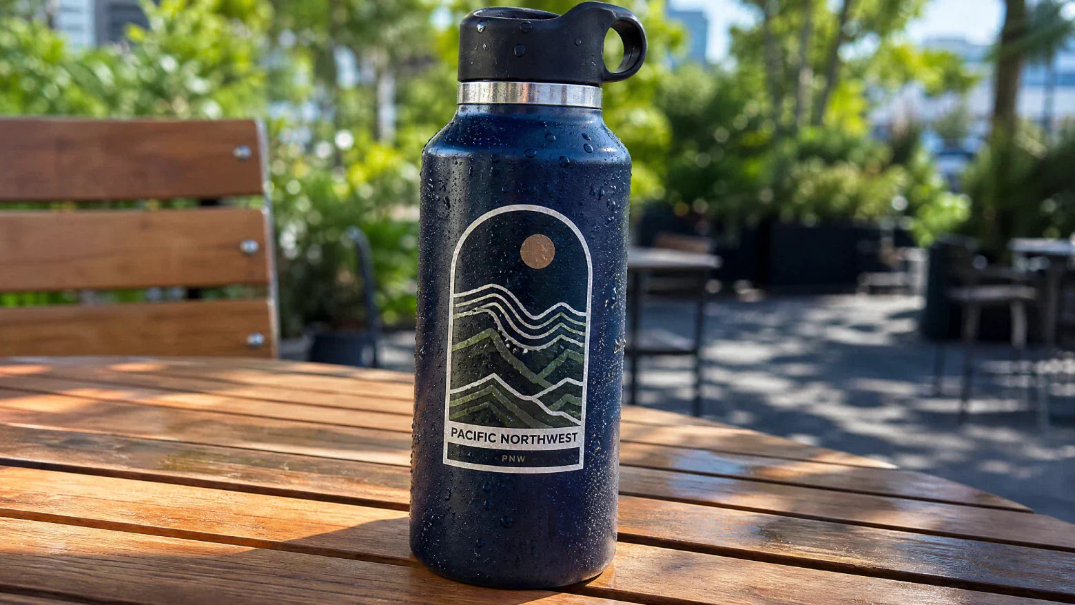 Real-life test of waterproof custom vinyl stickers on a water bottle by OkayStickers