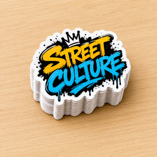 Neat stack of 2.5-inch custom Street Culture graffiti die-cut vinyl stickers on wooden table
