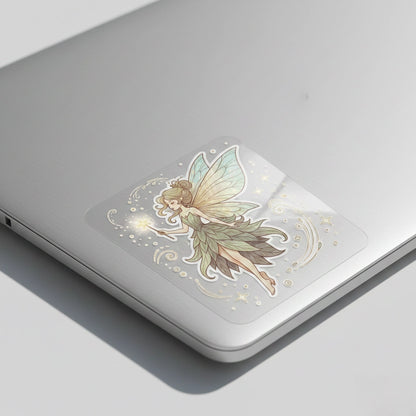 Ultra clear die cut fairy girl vinyl sticker applied on silver laptop corner, seamless transparent edges with printed-on effect and soft natural lighting